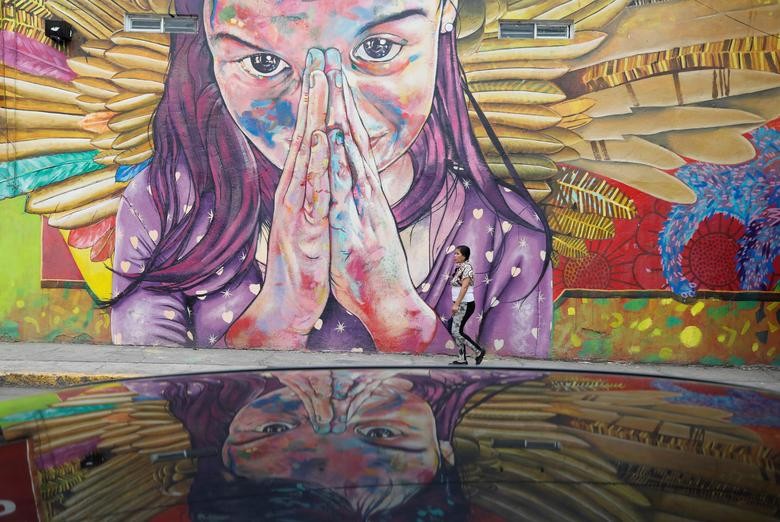 A woman is pictured in the municipality of Iztapalapa as the outbreak of the coronavirus continues in Mexico City. REUTERS/Carlos Jasso